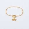 Zestaw srebrna pozłacana bransoletka i zawieszka w kształcie rozgwiazdy.