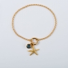 Zestaw srebrna pozłacana bransoletka zawieszka rozgwiazda zawieszka z niebieskim oczkiem.
