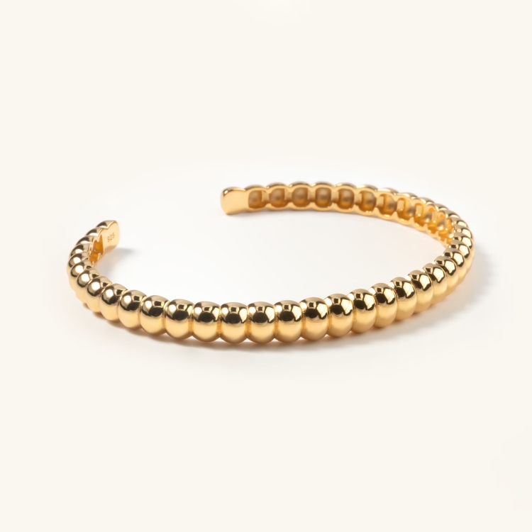 Bransoletka sztywna srebrna pozłacana otwarta.