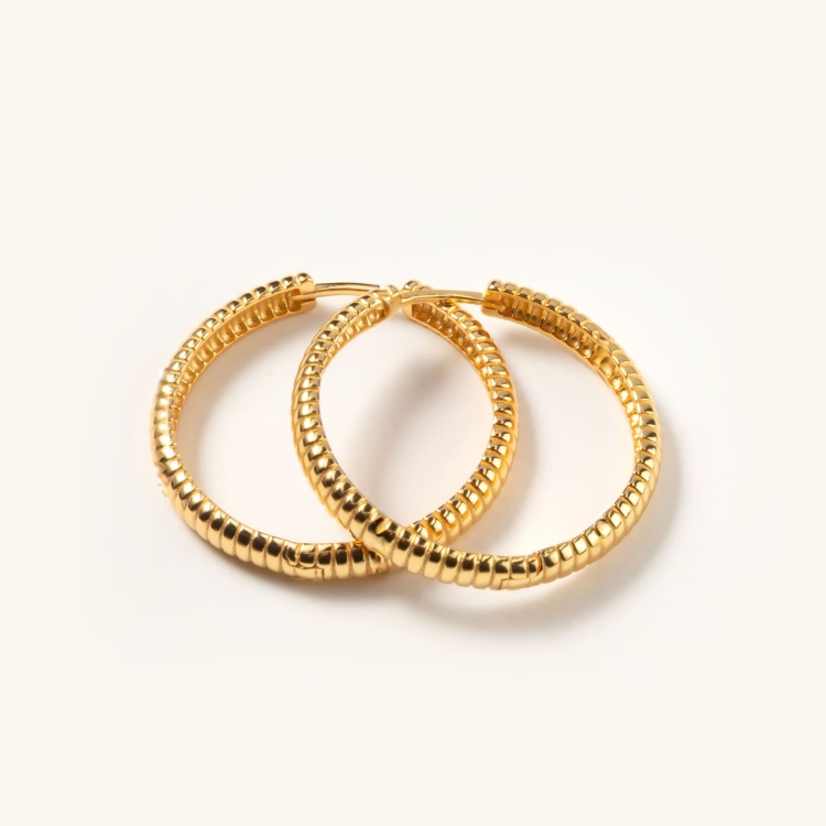 Kolczyki srebrne pozłacane koła karbowane.