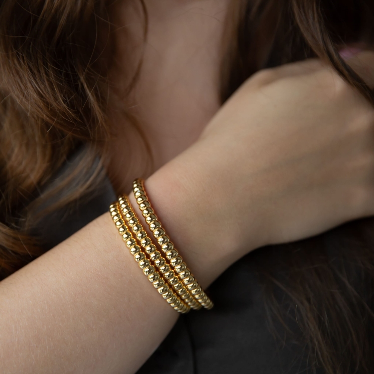 Bransoletka sztywna srebrna pozłacana otwarta.