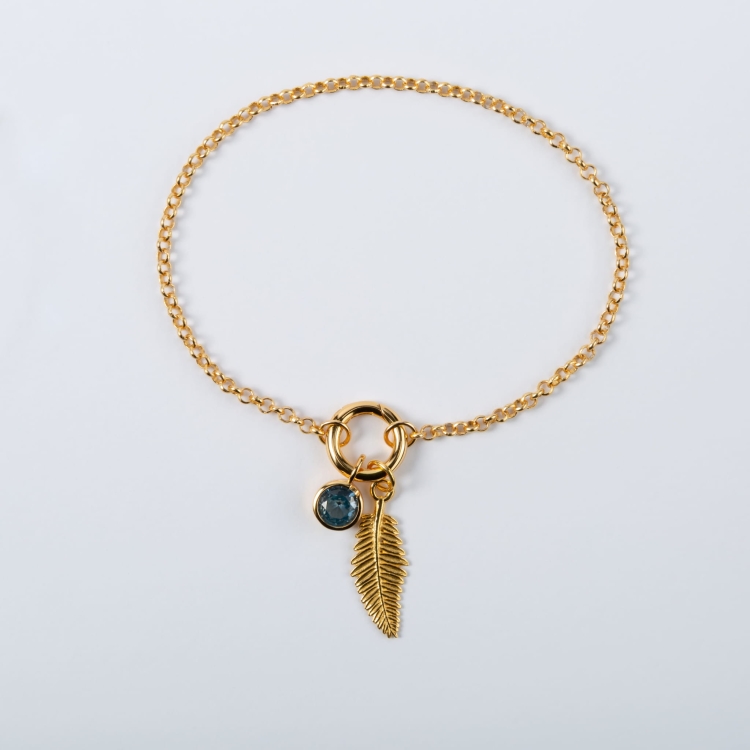 Zestaw srebrna pozłacana bransoletka zawieszka gałązka zawieszka z niebieskim oczkiem.