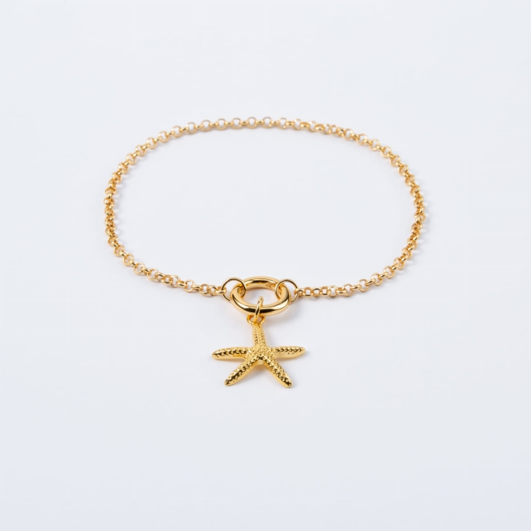 Zestaw srebrna pozłacana bransoletka i zawieszka w kształcie rozgwiazdy.